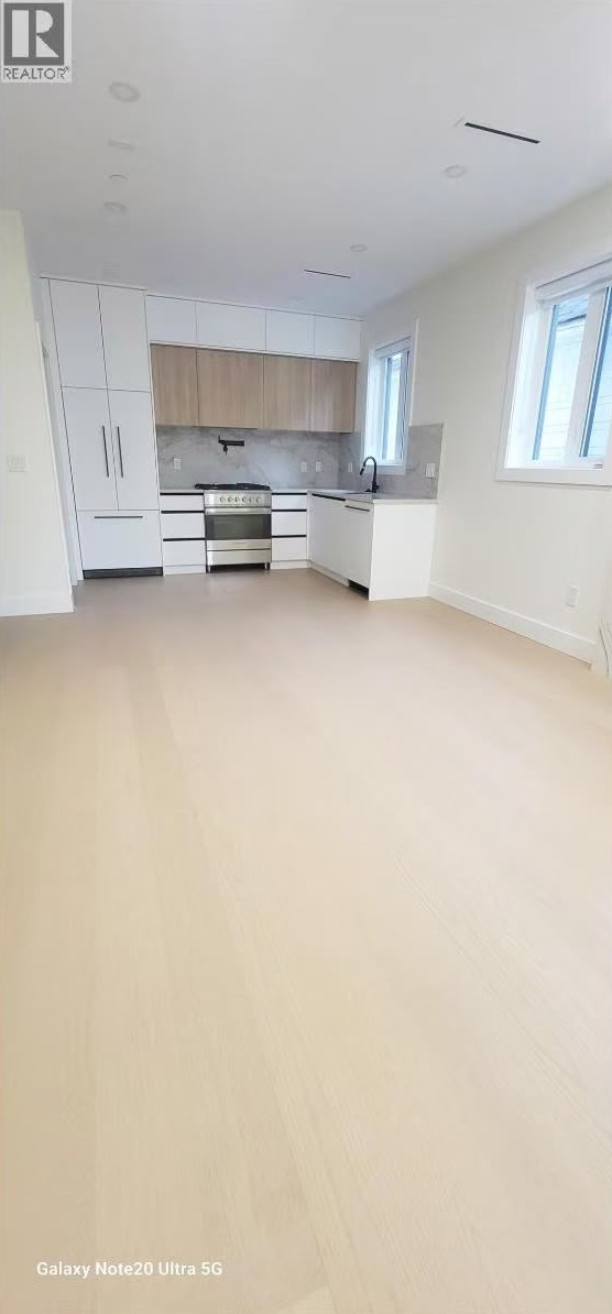 Open-plan main floor looking toward the kitchen