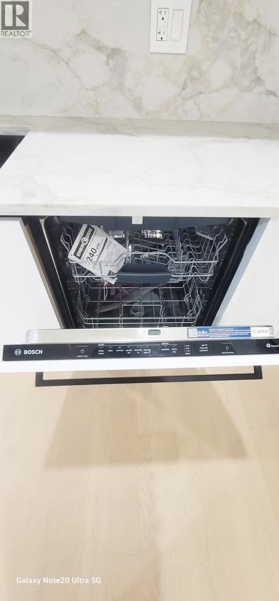 Integrated dishwasher below marble-look countertop