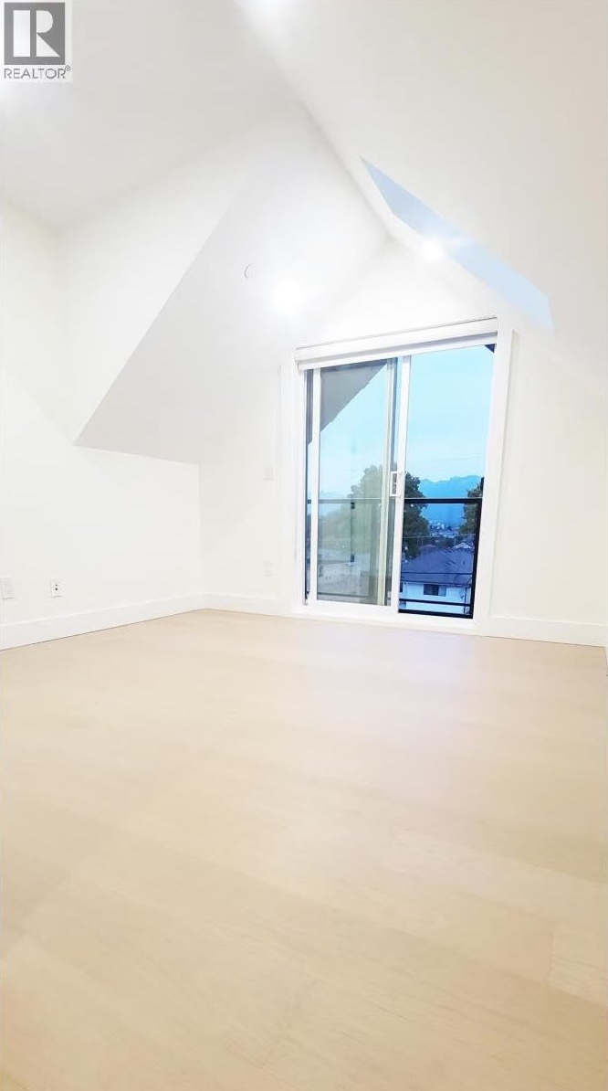 Loft bedroom with balcony door and mountain view