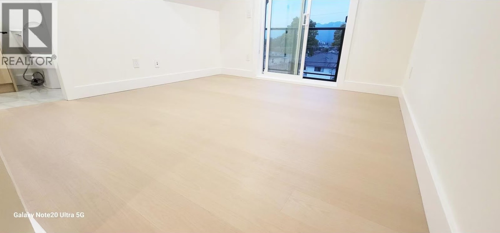 Wide-plank light oak flooring in loft bedroom