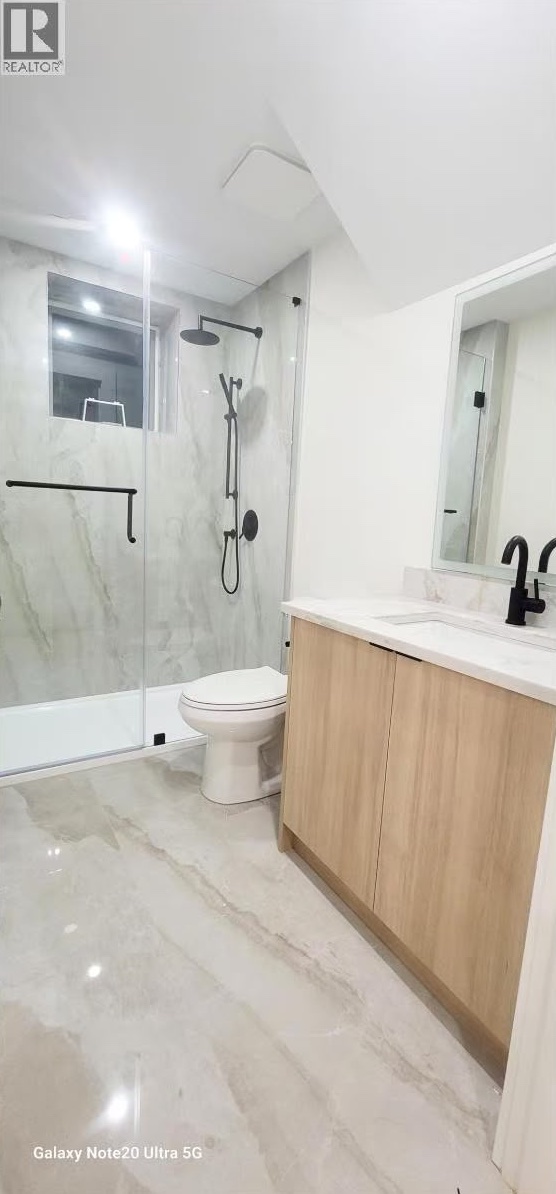 Walk-in shower with rain head and matte black fixtures